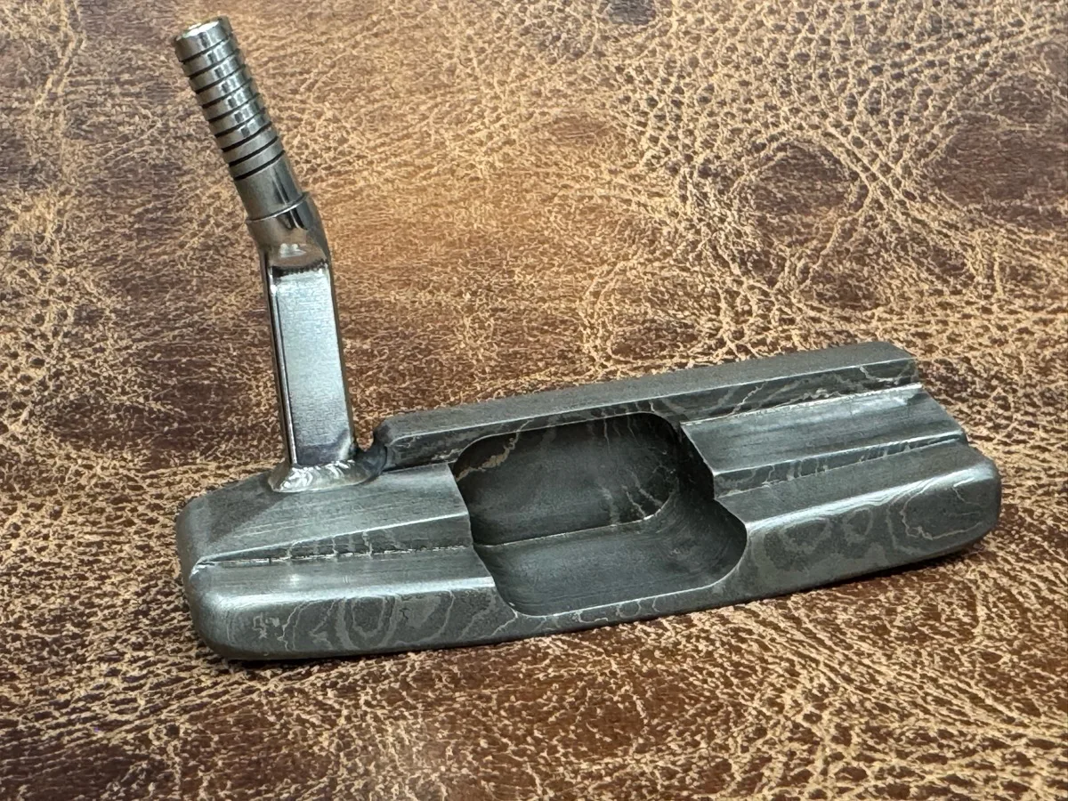 Wild hair and a block of Damascus. Not really shaped to resemble anything, but she'll probably go on a "Thin My Bumpers" — photo 5 of 5