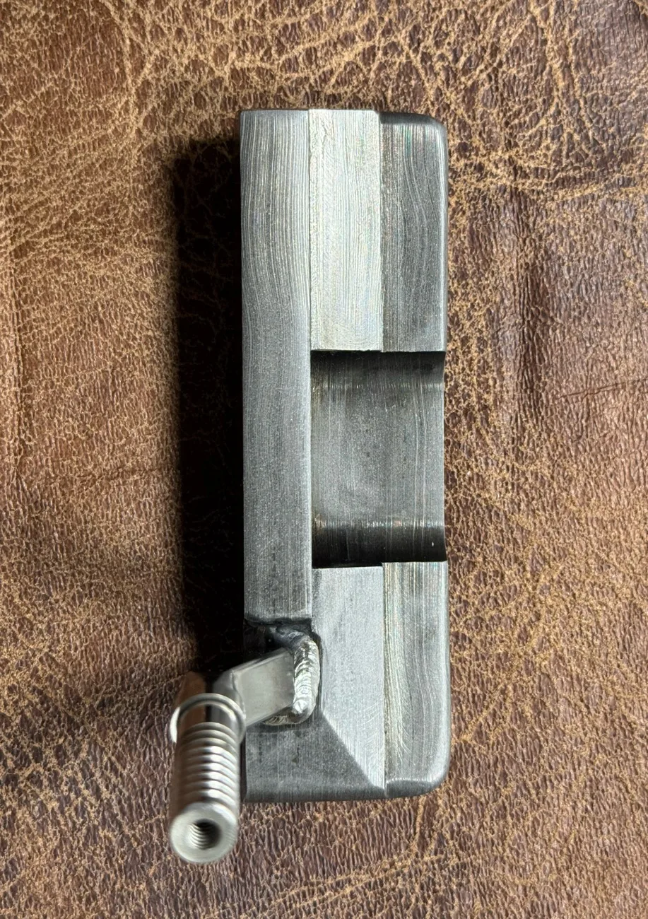 Wild hair and a block of Damascus. Not really shaped to resemble anything, but she'll probably go on a "Thin My Bumpers" — photo 4 of 5