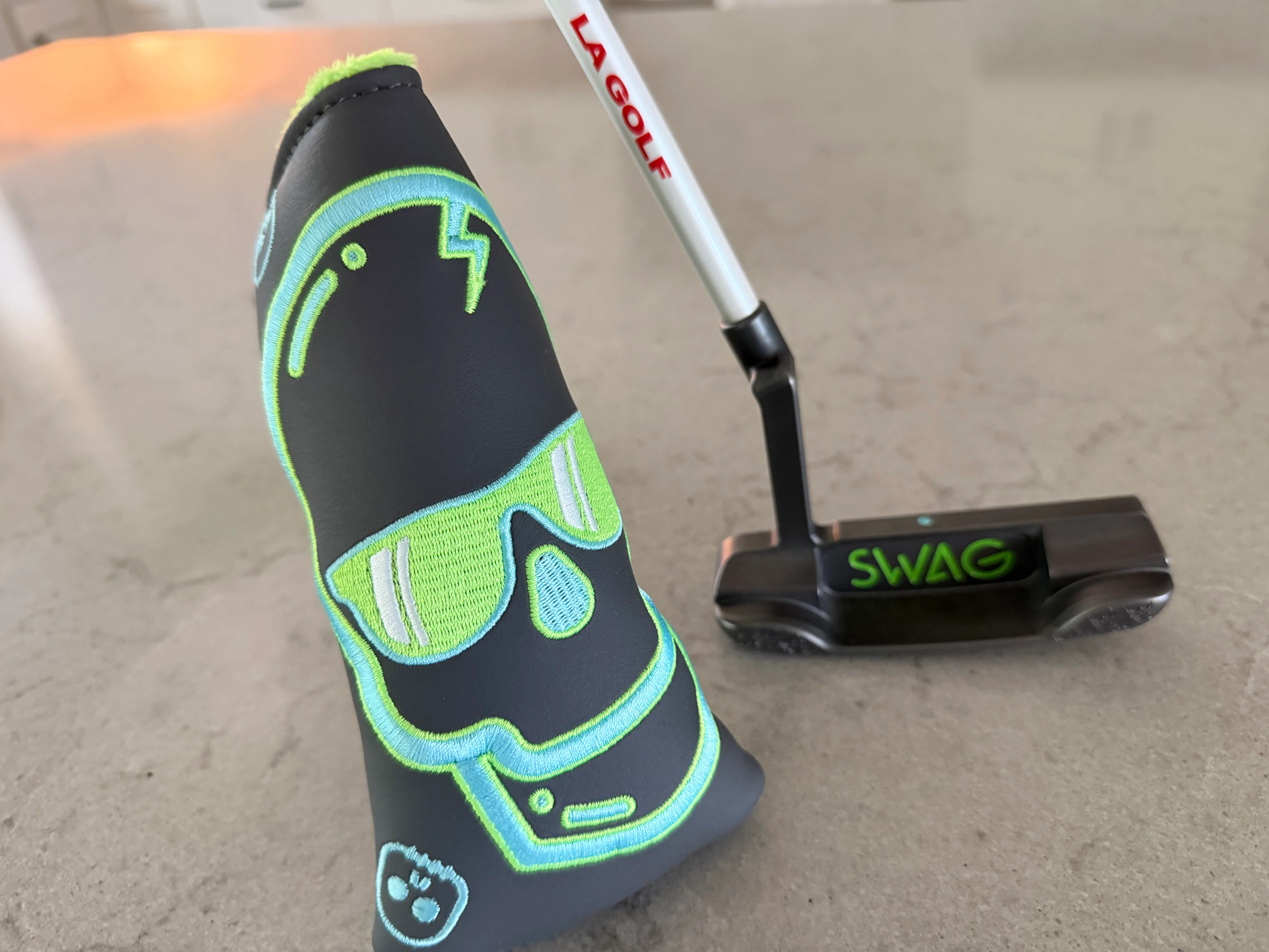 My gamer from when I worked at Swag. Putter came first, and then the colors looked cool together so a matching headcover — photo 1 of 4